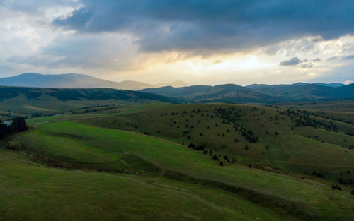 Scenic view of landscape against sky during sunset