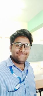 Portrait of young man wearing eyeglasses