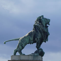 Low angle view of statue against sky