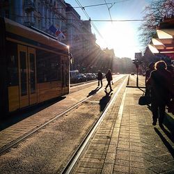 People walking on road in city