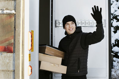 Courier holding parcels