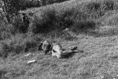 High angle view of girl lying on field