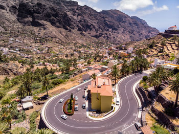 High angle view of road amidst trees in city