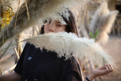 Portrait of woman with ice cream in winter