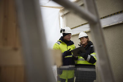 Engineers talking at building site