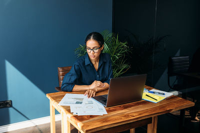 Businesswoman working at table