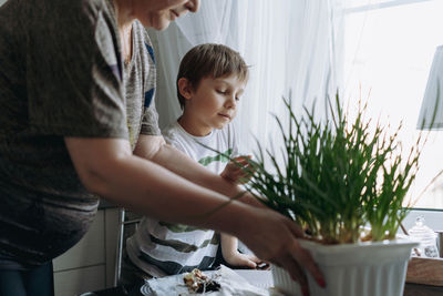 High angle view of mother and daughter at home