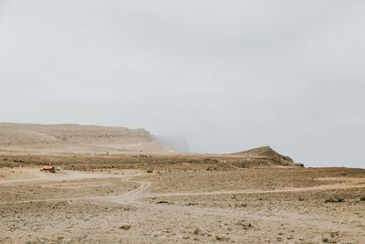 Scenic view of desert against sky