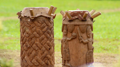 Close-up of wooden post on field