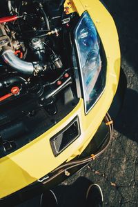 High angle view of yellow car on road