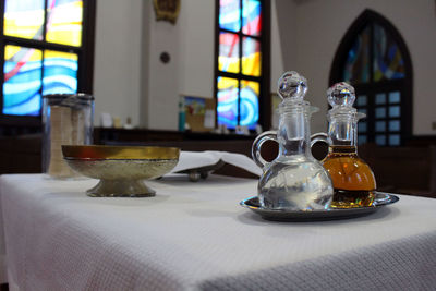 Close-up of glasses on table at home