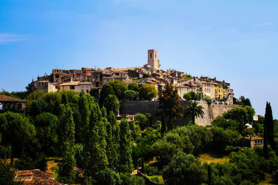 Low angle view of buildings against blue sky