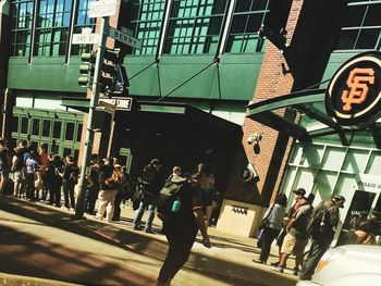 People walking on street in city