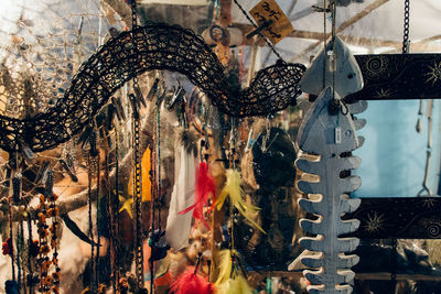 Close-up of accessories in fish sculpture at store