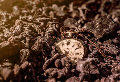 Close-up of clock on stone wall