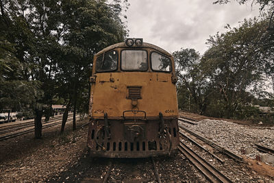 Train on railroad track against sky