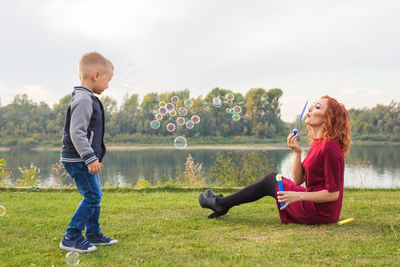 Side view of couple sitting outdoors