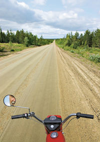 Bicycle on road against sky