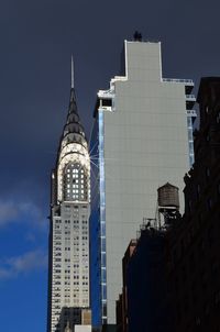 Low angle view of buildings in city against sky