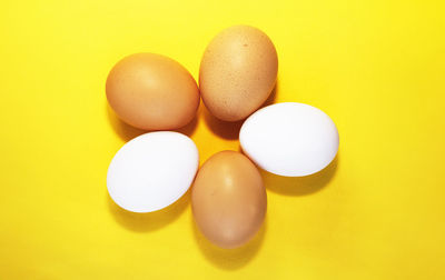Close-up of pills against yellow background