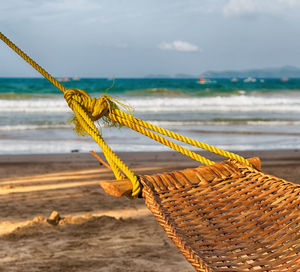 Close-up of rope tied on sand