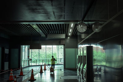 Woman walking in corridor