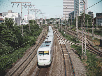 Train on railroad tracks in city