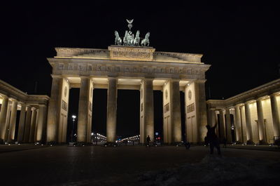 Low angle view of historical building at night