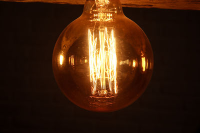 Close-up of illuminated light bulb