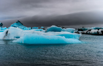 Scenic view of sea against sky during winter