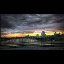 View of bridge against cloudy sky