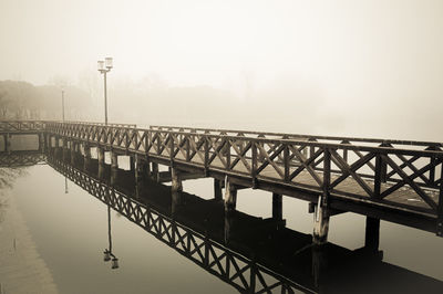 Bridge over river against sky