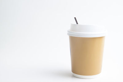 Close-up of coffee cup against white background