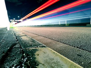 Light trails on road in city at night