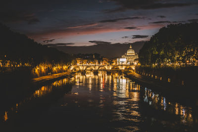 View of illuminated buildings at sunset