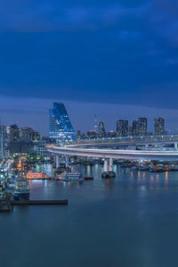 Circular highway leading to the rainbow bridge in odaiba bay of tokyo.