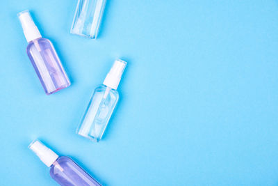 High angle view of blue bottles on table