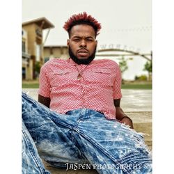 Portrait of young man sitting outdoors