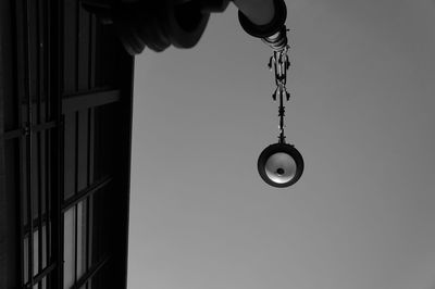 Low angle view of illuminated street light against sky