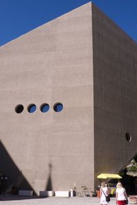 Low angle view of building against clear blue sky