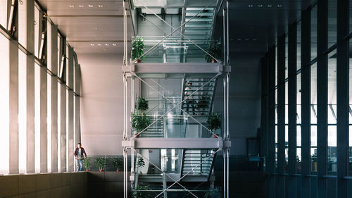 Reflection of people on glass window in building