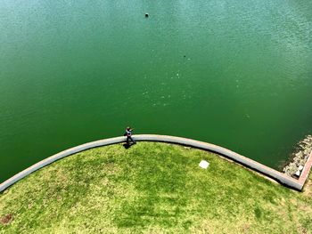 High angle view of man fishing in lake
