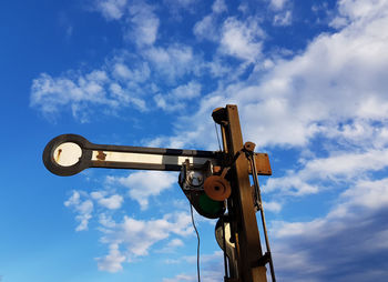 Low angle view of crane against sky