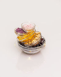 High angle view of jar on table against white background