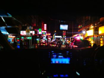 Illuminated lights in city at night