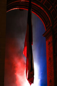 Low angle view of flag against sky