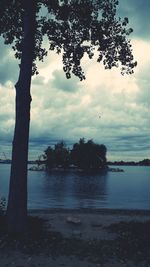 Scenic view of sea against cloudy sky