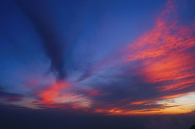 Low angle view of dramatic sky at sunset