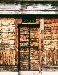 Closed wooden door of old building