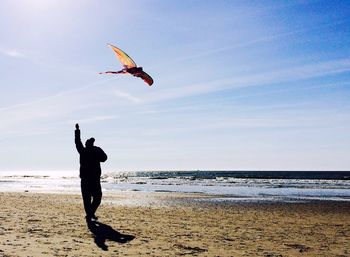 Woman jumping on beach